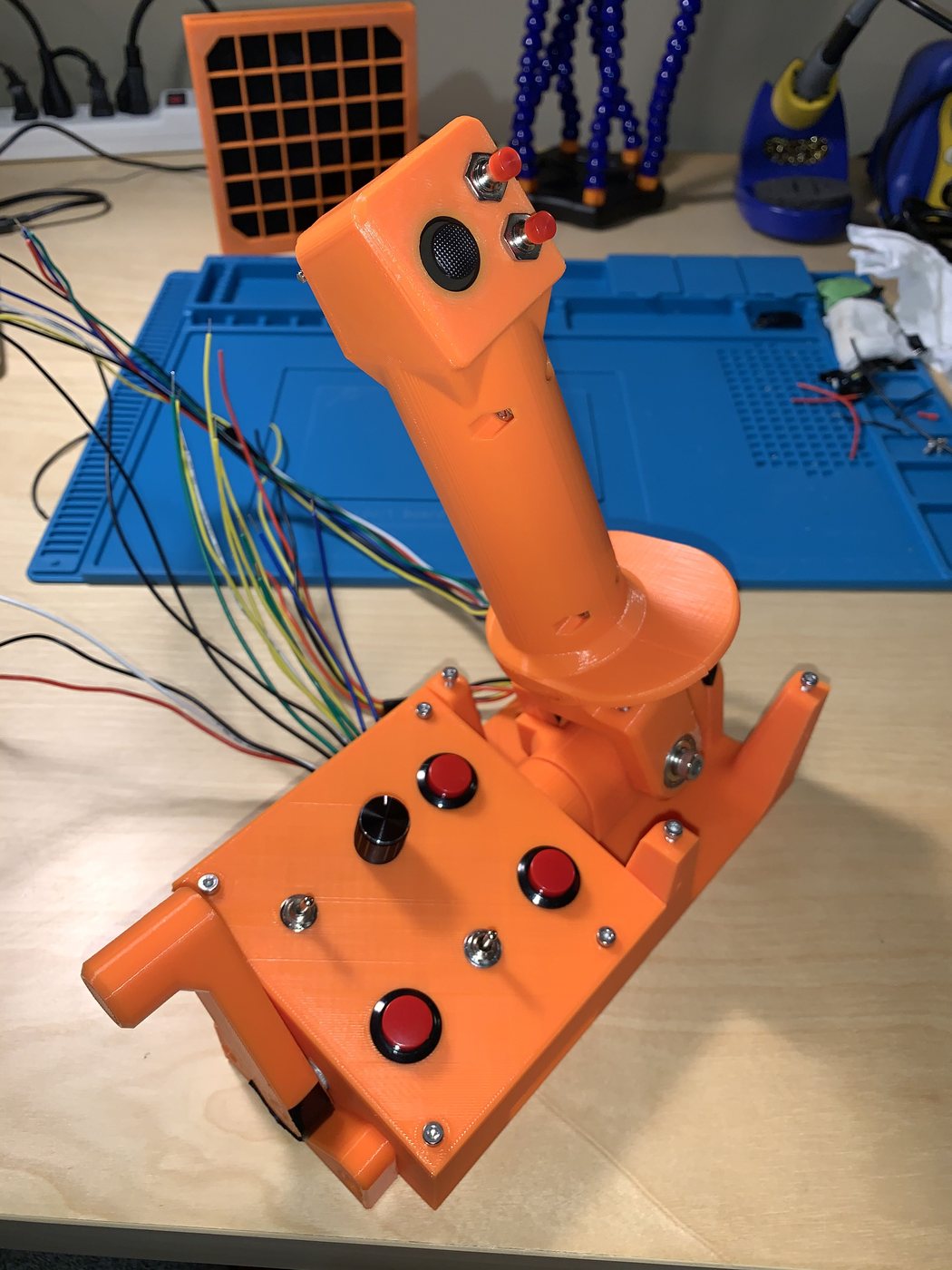 The assembled joystick and base with its loom of coloured wires still hanging out of the base.